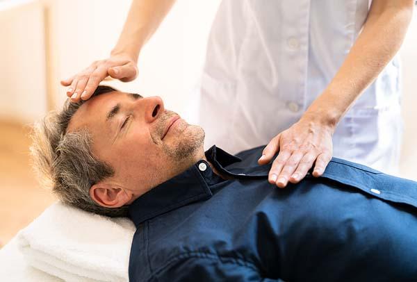 Reiki Therapy Alternative Healing Massage on man
